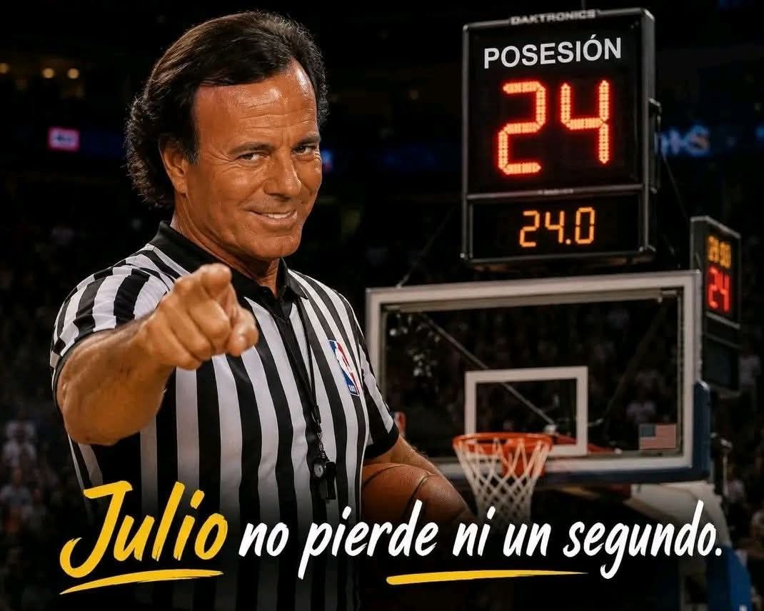 a man in a referee s uniform pointing at the camera